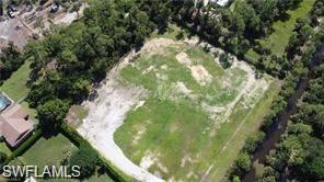 Very private canal-front lot located at the end of the road in Golden Gate Estates.  No road frontage or traffic noise. Ideally situated just south of Pine Ridge Road and west of Collier Boulevard, this desirable 2.5-acre parcel offers the perfect setting to build your custom home. No HOA restrictions. Conveniently located ~1 mile from Publix, banking, and shopping.