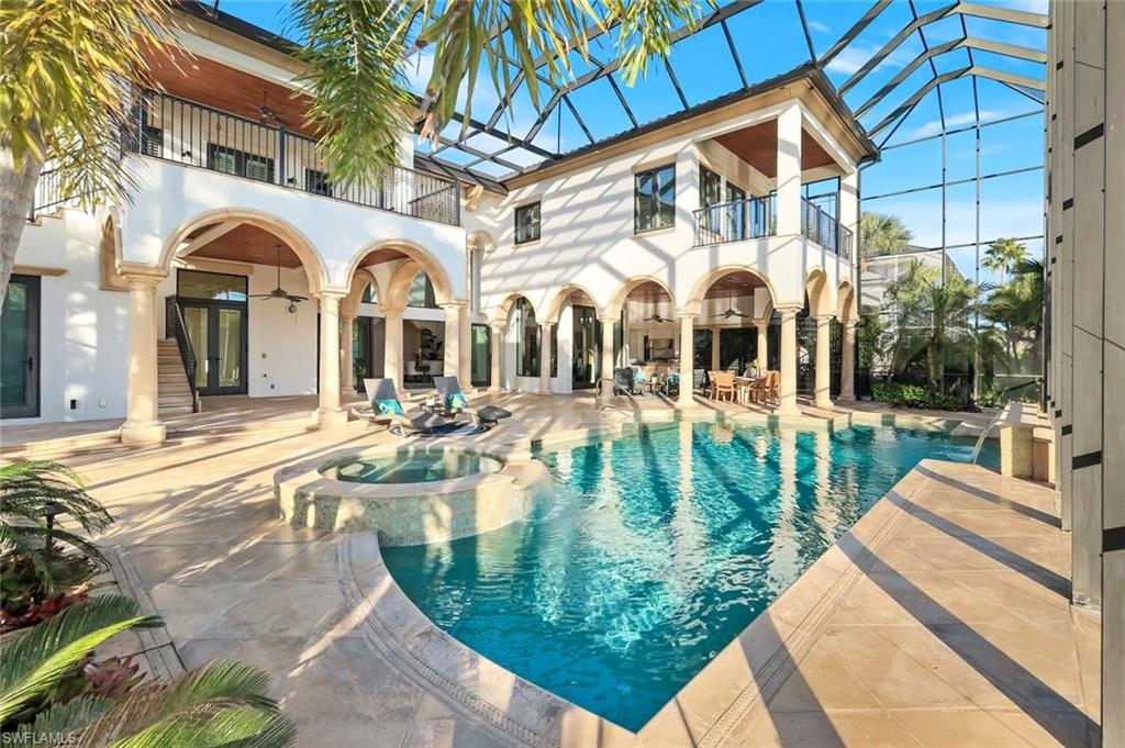 Rare waterfront estate on exclusive Southpointe Island at Windstar on Naples Bay. Tucked behind double gates within an intimate enclave of only ten estate residences, this exceptional property offers privacy, direct Gulf access, and an unparalleled Naples lifestyle just minutes from downtown and world-renowned beaches.
Positioned on nearly half an acre, this home features a private 40-ft dock in the backyard with the option to purchase an additional 50-ft protected slip in Windstar’s private marina—an extraordinary offering seldom available in Naples Bay communities.
Spanning over 6,100 sq ft of refined interior living space, this 5-bedroom + den, 4 full and 2 half bath residence showcases spectacular 20+ ft contoured ceilings, abundant natural light, and meticulous attention to detail throughout. The chef’s kitchen is designed for both function and style, featuring custom cabinetry imported from Japan, quartzite countertops, a gas cooktop island, premium appliances, and seamless flow to the expansive outdoor living areas.
The luxurious owner’s suite offers tranquil water and preserve views, a private balcony, and a spa-inspired bath with jetted soaking tub and walk-in steam shower. An elevator provides convenient access to the second level. Impact-resistant WinDoor windows and doors and a newer roof provide peace of mind.
Outdoor living is exceptional, with nearly 5,000 sq ft of covered and open-air space including multiple balconies, a custom saltwater pool and spa with cascading water features, summer kitchen, and spacious lanai—ideal for entertaining or quiet waterfront relaxation.
Residents of Windstar on Naples Bay enjoy access to a full suite of private club amenities, including championship golf, tennis, an active clubhouse, private beach access via shuttle, and a full-service marina with harbormaster. Membership opportunities subject to club approval and availability.
A rare opportunity to own an estate-level waterfront home combining boating, privacy, and proximity at an exceptional value on Naples Bay.