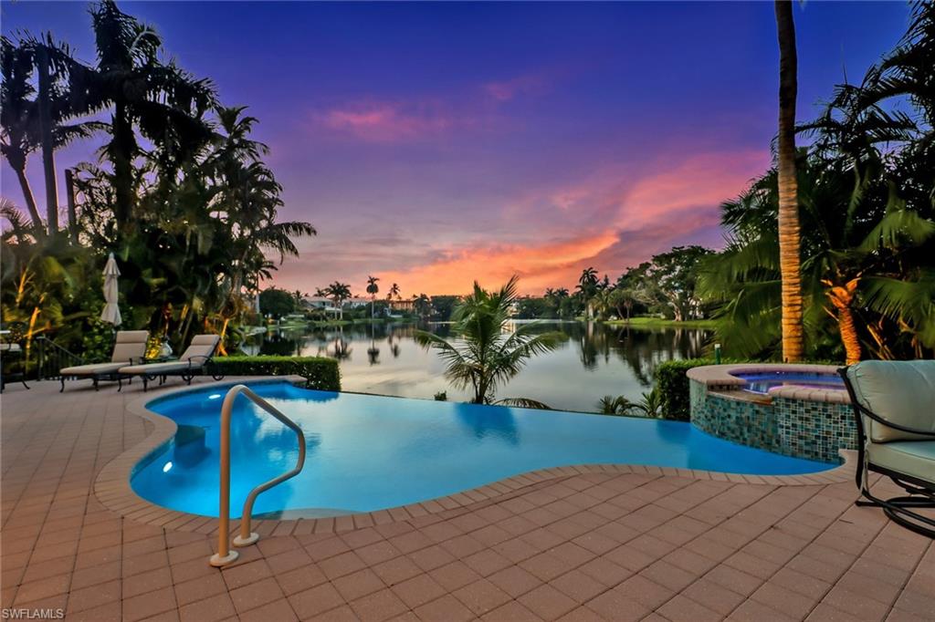 Enjoy living in downtown Naples in this elegant home on Spring Lake. Relax in the recently renovated interiors of this 4,139 square foot home, with classic open floor plan.  Be inspired by the dramatic sweeping views of your infinity pool, calm lake waters, and majestic palm trees. It’s your idyllic  retreat just three blocks from the excitement, shops, restaurants, and services of 5th AVE, and only blocks to the beach. Entertain in style in your great room, gourmet kitchen and lakefront deck with outdoor kitchen, infinity pool and spa.Your guests will enjoy the privacy of second level bedrooms with balcony access and en suite baths.  Take a short stroll to Cambier park for outdoor movie nights, live music at the amphitheater, and lighted tennis courts.  Make the most of your days and evenings, enjoying relaxed living and the variety of entertainment options just steps from your front door.