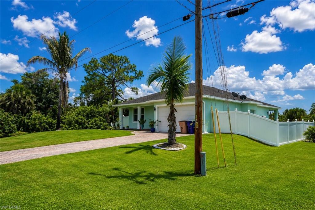 Welcome to this well-maintained and move-in ready home in the heart of Lehigh Acres. This beautiful property features a stunning paver driveway and entry, upgraded tile flooring throughout, and tastefully remodeled bathrooms with modern tile work, updated fixtures, and stylish finishes that add both comfort and elegance.

The seamless tile flooring throughout the home provides a clean, modern appearance while offering durability and easy maintenance. The fully fenced backyard creates a private outdoor retreat with plenty of space for entertaining, family gatherings, pets, or simply enjoying the Florida sunshine.

Additional upgrades include a recently installed whole-house water purification system and a reverse osmosis system in the kitchen, providing high-quality filtered water throughout the home and purified drinking water directly from the tap.

Conveniently located in a peaceful and growing neighborhood with easy access to schools, parks, shopping, dining, SR-82, I-75, Fort Myers, and Southwest Florida International Airport, this property offers the perfect blend of comfort, convenience, and Florida living.