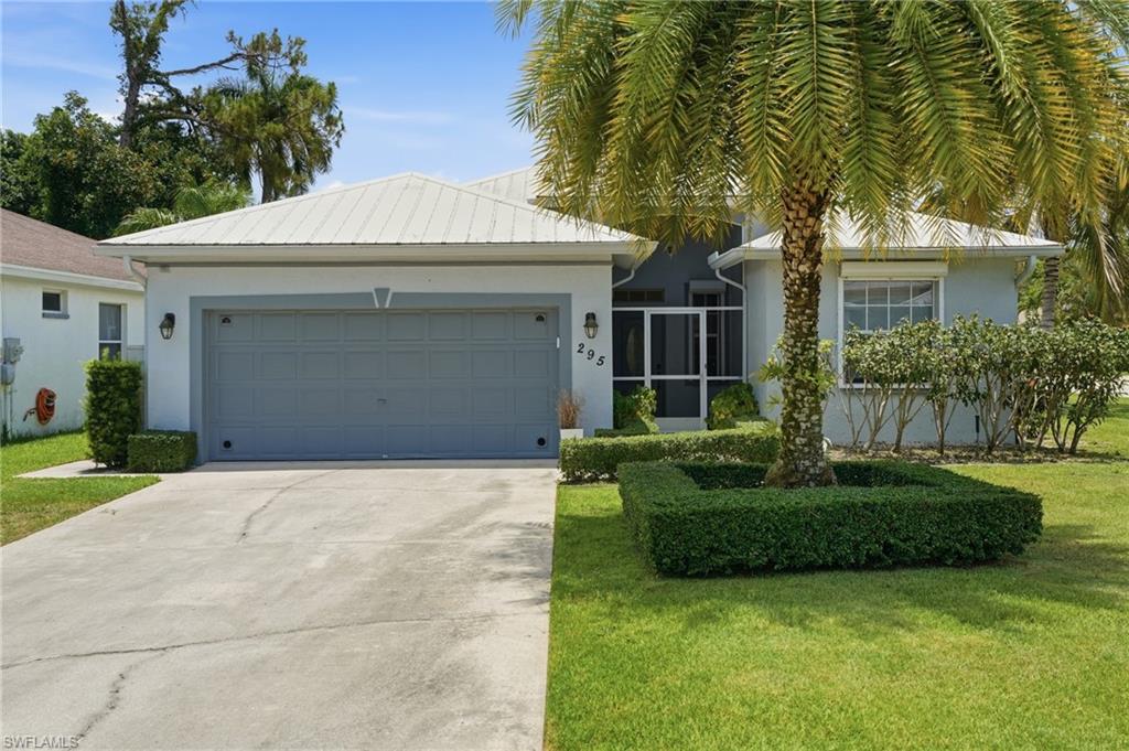 Cheerful Pool Home on a Large Corner Lot!  Not 10 minutes from Naples most famous beaches, this pool home offers 2 bedrooms and a large den with oversized 2 car garage, open floor plan, generator, metal roof, granite in kitchens and baths and storm protection. Spacious great room concept home offers so much! Stretch out for a nap by your solar heated swimming pool...a white energy efficient metal roof (2013).   Warm and welcoming with a peek of a lake view from the pool lanai with under cover outdoor patio area. Lovely Maplewood just east of Livingston and 10 minutes from beaches and 5th Ave., affordable association fees make this the perfect place to begin your new adventure in Naples FL.