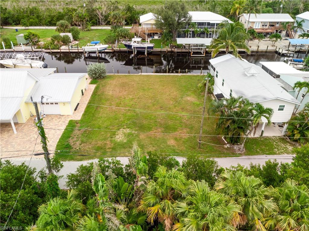 Welcome to 16220 Antigua Way, a prime sailboat access cleared lot in Bokeelia, located on the tranquil north end of Pine Island. This gem offers direct Gulf access with no bridges, allowing for an effortless short boat ride to the stunning Charlotte Harbor. Anglers will delight in the world-class fishing opportunities nearby, from the back bay to the renowned Boca Grande Pass. Spend your days basking on the pristine sands of Cayo Costa Beach or exploring the beautiful outer islands. This location is a paradise for water enthusiasts seeking to immerse in the abundant natural beauty and vibrant marine life of the area. Don't miss the chance to create your dream waterfront retreat in this great location.