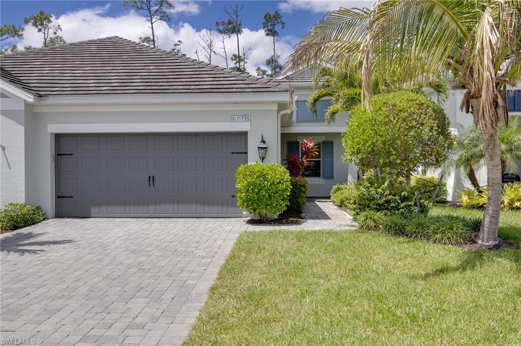 This attached villa in Windsong is move-in ready for you to start enjoying a Florida lifestyle. With 2 bedrooms + a den, the open floor plan is inviting. It features plank tile flooring throughout main living area, both baths and the den. There's carpet only in the 2 bedrooms. The Kitchen with its large island has wood cabinetry, quartz counters and stainless appliances, including a natural gas range. The oversized extended brick paver lanai offers a tranquil view of the private wooded area behind the villa. The primary bath has a large walk-in closet with custom built-ins and double vanities. This gated community of 104 homes has a community pool and spa, clubhouse, cabana, and dog park. It is not in a flood zone and there aren't any Community Development District ( CDD) fees.