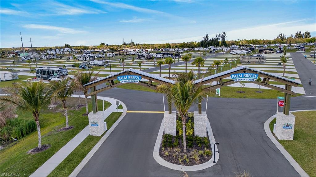 Welcome to Palm Breeze RV Resort, Southwest Florida’s premier luxury RV community. This desirable corner lot is ideally located just steps from the clubhouse, resort-style pool, fitness center, and exceptional community amenities, offering both convenience and a vibrant resort lifestyle.

This homesite is ready for your personal vision, with ample space for your RV along with the opportunity to design a custom tiki hut, extended paver patio, lush tropical landscaping, and outdoor entertaining area to create your own private retreat in paradise. The corner location enhances privacy while providing flexibility for RV positioning and outdoor living design.

Palm Breeze RV Resort features beautifully maintained grounds, upscale amenities, and an active social calendar, making it one of Southwest Florida’s most desirable RV resort destinations.

Conveniently located in Punta Gorda, residents enjoy easy access to the charming historic downtown Punta Gorda waterfront district, along with nearby shopping, dining, and entertainment. The resort is also within comfortable driving distance of Fort Myers, Venice, and many of Southwest Florida’s beautiful Gulf Coast beaches, offering endless opportunities for recreation, boating, golf, and coastal living.

An exceptional opportunity to own a prime corner location in one of Southwest Florida’s most sought-after RV resort communities.