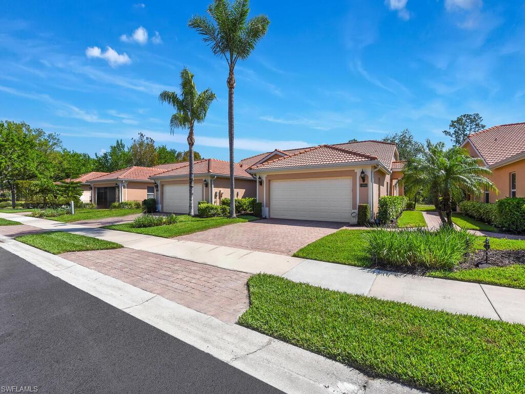 Tuscany Cove is located in a prime North Naples location just steps away from the new Founders Square where you will find exciting restaurant choices. This 3 bedroom 2 bathroom attached villa is in pristine condition and located close to the amenity center. Enjoy the spacious open feel of this home which extends onto an expanded screened lanai and patio area. New AC 2023, new water heater 2022, updated screens and landscaping in 2023. The home features rolling hurricane shutter on lanai, accordion shutter and storm panels. Tuscany Cove offers a resort style community pool, exercise room, tennis courts and much more.  Located in one of Naples top school zones and with easy access to I75 and all Naples has to offer this home has it all.