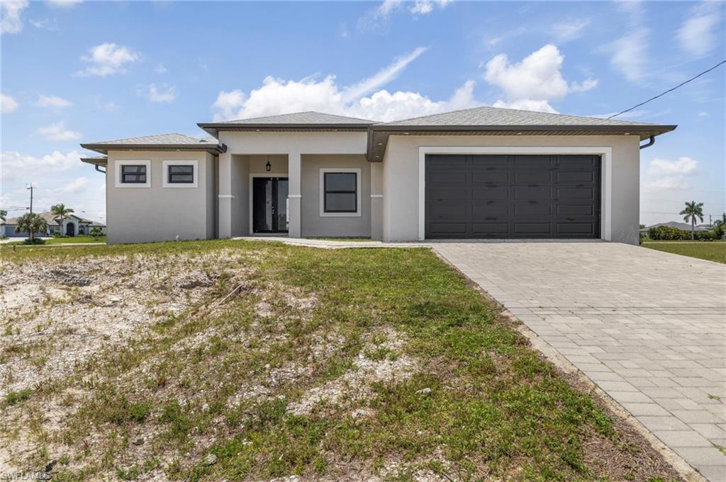 Exceptional opportunity to complete and customize this unfinished home located in desirable NW Cape Coral. Offering approximately 1,918 square feet of living space, this property features a well-designed split-bedroom floor plan with 3 bedrooms, a den/home office, 2 full bathrooms, and a 2-car attached garage.

The thoughtfully planned layout provides an open and functional living space, with a private primary suite separated from the secondary bedrooms for added comfort and privacy. The den offers flexibility for a home office, media room, or additional guest space. A covered rear patio extends the living area outdoors and provides the perfect setting for future entertaining and relaxation.

This home is currently unfinished and is being sold as-is, presenting a unique opportunity for investors, builders, contractors, or buyers looking to complete a property to their own specifications. Bring your vision and finishing touches to transform this house into a beautiful custom home.

Conveniently located near shopping, dining, schools, parks, and all that Cape Coral has to offer. Don't miss this chance to add value and create the home you've been envisioning.