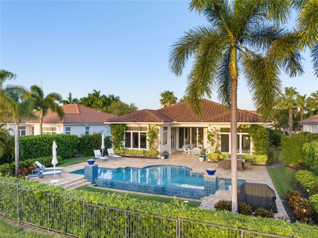 Step into a haven of sophisticated luxury at GREY OAKS! This immaculate single-story residence, built in 2015, merges functional elegance with contemporary comforts, creating an exceptional living experience. To Get a feel of this beautiful home please view the VIRTUAL TOUR VIDEO ATTACHED!
The home's centerpiece is a spacious great room with soaring cathedral ceilings and expansive windows, showcasing serene lake views.  The kitchen offers a generous island that invites social gatherings and culinary creativity, seamlessly extending into the family room for an open-concept feel. The master suite is a true sanctuary, designed to offer ultimate privacy and luxury. 
The outdoor lanai offers an infinity pool and spa and a sophisticated outdoor lighting system, perfect for evening entertainment. The residence boasts a long driveway that enhances its grand approach. Residents of GREY OAKS enjoy three championship golf courses, a full-service spa, tennis courts, and multiple dining venues. Minutes from Naples' vibrant 5th Avenue, the upscale Mercato, and pristine beaches, this home is ideally positioned for enjoying the best of Southwest Florida’s lifestyle. Embrace luxury living in GREY OAKS, where every detail is tailored for comfort and grandeur.