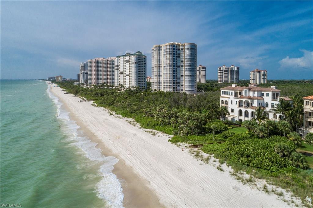 Coastal contemporary Gulf-front estate with 132 feet of pristine beach frontage, expertly recrafted by BCB Homes in the Strand at Bay Colony, Naples’ most exclusive gated enclave. Breathtaking vistas of the Gulf of Mexico and preserve. Beautifully designed grounds with manicured lawns and lush gardens. The 7,342 sq ft furnished residence includes 5 bedrooms, 6 bathrooms, spacious living and dining areas, gym and media room on 4 levels. Bright and airy throughout, with floor to ceiling windows, custom millwork, tasteful marble and wide plank hickory floors. A gourmet kitchen features quartz and mahogany countertops, custom cabinetry and chef’s appliances. The family room and breakfast area open to a Gulfside pool, outdoor kitchen and covered dining. The 4 en-suite guest quarters, including a private cabana, offer unparalleled luxury for visitors. A full floor master suite features oversized sleeping area, fireplace, breakfast bar, marble bath, custom closets, and office. Hurricane doors and windows. World-class amenities include restaurants, gym and spa, tennis courts, and optional golf club membership. Arguably the most stunning beachfront home available in Southwest Florida.