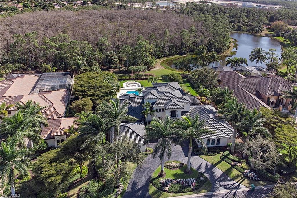 This beautiful estate home was recently renovated inside and out including all new furniture so you can avoid the lengthy time, frustration, and rising costs of doing this yourself.  Located in the premium neighborhood of Padova at Mediterra.  Among the distinct features are a rare 4 car garage, 4 bedrooms plus office, bonus room and a fitness room currently equipped with a golf simulator.  The outdoor living areas are impressive with a private screened courtyard with fireplace and built-in grill off the kitchen, a meditation garden with outdoor shower off the master bedroom, and a spacious open air pool/spa area with sunning decks and backyard (a scarce find within a gated Naples community) with a southeastern lake view.  Don’t miss this opportunity!  Buyer to assume CDD.