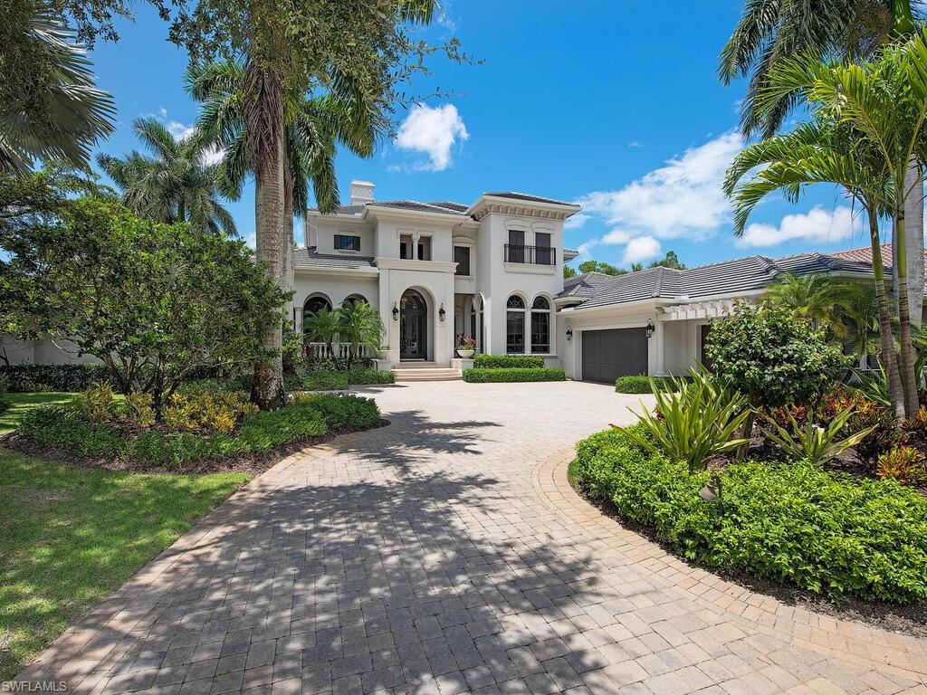 This magnificent two-story estate built by Harwick Homes is updated in light & bright tones. Tasteful designer appointments & architectural features are found throughout including soaring coffer & tray ceilings, elevator, impact windows & doors, wet bar, butler’s pantry & travertine marble & wood floors. Volume ceilings set the tone for grandeur in the formal living room with disappearing sliders allowing natural light to flood the space. The spacious kitchen offers light wood cabinetry, quartz countertops & built-in appliances including two dishwashers, oven with warming drawer & large gas range. The main floor master suite is a serene retreat with wood floors, sitting area & French doors opening to the lanai. Ascend the grand staircase or ride in the mahogany adorned elevator to the second-story loft featuring a wet bar and French doors to a wraparound veranda & two large bedrooms. A gas fireplace & summer kitchen with built-in grill & work sink are found on the loggia. Electric roll down screens allow the space to be utilized year-round. A multilevel lanai surrounds the bubbling fountain pool & spill-over spa with unparalleled golf course views. *2 year old roof - A/C 5 yrs old*