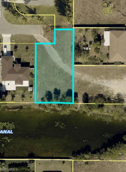Rare oversized freshwater canal lot ON A 120 feet WIDE CANAL! This unique homesite offers an unique shape that provides extra space and flexibility for designing your dream home while maximizing privacy and waterfront views. Located in the desirable NE Cape Coral, this area recently completed the City Utilities Expansion Area, with city water and sewer available, adding tremendous long-term value. Enjoy boating, kayaking, fishing, and peaceful waterfront living on the freshwater canal system. Conveniently located near shopping, dining, schools, parks, and the exciting growth taking place throughout Northeast Cape Coral. Whether you’re ready to build now or invest for the future, this oversized waterfront property is an exceptional opportunity.
