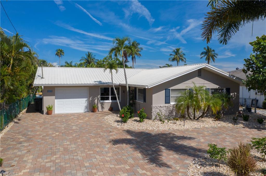 Attention all BOATERS & FISHERMEN -BEAUTIFULLY REMODELED GULF ACCESS HOME! Just minutes to the BEST boating & fishing sites in SWFL. NO Bridges or Locks to clear your vessel, less then 1 mile to OPEN water. This is the PERFECT RETREAT FOR ANYONE LOOKING FOR A WELL-MAINTAINED HOME in Mathlacha ISLES!!! This Newly landscaped home features a remodeled Kitchen w/large center island open to the living area for entertaining with stainless steel appliance's & granite countertops plus remodeled bathrooms. The home is freshly painted light and bright, with a BOAT DOCK and COVERED LIFT 7,000 lb, WALK-A-ROUND boat captains walk decking, fish cleaning station, NEW kayak lift, Large ENCLOSED Florida room that has sliders for views of the water. NEW epoxy garage floor. Reroof Metal Roof 8-2014, Electrical Panel Change Out in 8/2014, A/C System 2016. Large outdoor deck area with multiple outdoor living spaces. Master bedroom has sliders out to a private sun deck. With a location that can't be beat, close to restaurants, shopping and the historic Matlacha Village. This home is a perfect retreat or income producing property. This one will go fast, don't miss your opportunity.