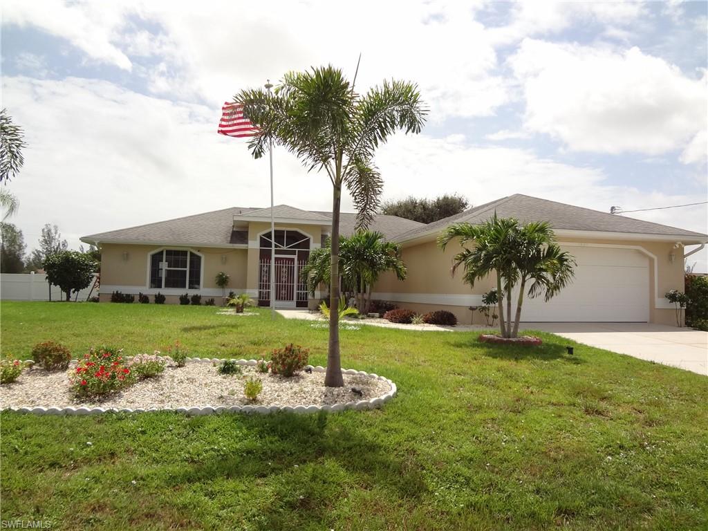 BEAUTIFULLY updated/upgraded home sits on OVER-SIZED 3 lot site, in fast growing NW Cape! BRAND-NEW ROOF August 2022!. Great floor plan with CATHEDRAL ceiling, split bedrooms, and LOTS of natural light & storage! HUGE back yard with plenty of room to add a pool! HUGE master bedroom with sitting area, & BIG walk-in closet! Luxurious master bath has dual sinks, walk-in shower, and '2 person', heart shaped, JACUZZI TUB! Pocket sliders from living room & a set off the kitchen to screened, tiled lanai. Fantastic kitchen with eat-in nook, pantry, NEW SAMSUNG APPLIANCES, glass backsplash, breakfast bar, & self-closing drawers! Inside laundry with laundry tub & 2 storage closets! Screened dbl door entry! All rooms have a/c returns! NEWER PORCELAIN 'PLANK' STYLE FLOORING throughout, with newer carpet in bedrooms! Many other 'newer' items; GRANITE tops, cabinets, baseboards, commodes, well pump, water softener & pressure tank, lighting, paint, landscaping, c-fans, fixtures, & more! Flood ins. NOT required! 'Ring' doorbell w/light. Sofa/sleeper in family room & dining room table w/6 chairs can stay. GORGEOUS HOME!