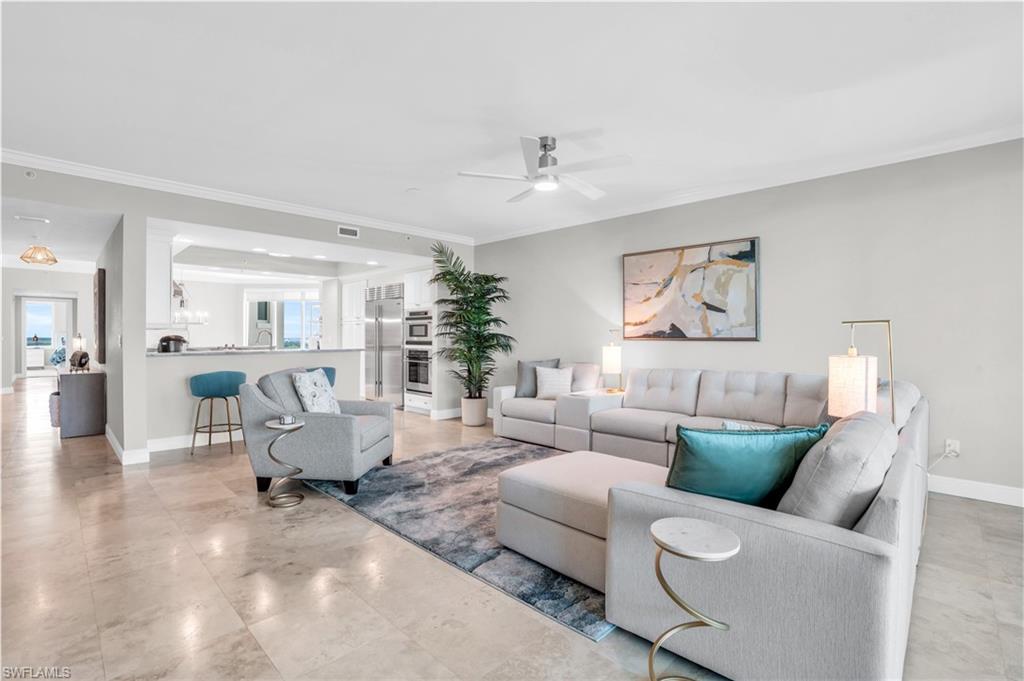 Discover elevated coastal living at 265 Indies Way, Unit #1404—a stunning sky residence where refined luxury, peaceful privacy, and sweeping Gulf-to-golf views come together in the most exclusive tower of The Dunes: Grande Geneva. Tucked away at the quiet edge of the community and surrounded by sparkling waterways and lush preserves, Grande Geneva offers unmatched seclusion within this prestigious Naples enclave. A private elevator opens directly into your home, immediately setting a tone of sophistication and exclusivity. This beautifully reimagined 3-bedroom, 3-bath sanctuary features polished marble flooring throughout the main living areas, blending timeless elegance with modern coastal design. It includes two assigned garage spaces and a rare transferable membership to The Floridian Club, an exclusive private beach club with daily shuttle service, full beachside food and beverage service, and effortless access to Naples’ pristine white sands. Residents of Grande Geneva enjoy resort-style amenities including a heated pool and spa, a state-of-the-art fitness center, a stylish social lounge with catering kitchen, and outdoor grilling areas. From the moment you enter, you are greeted with panoramic Gulf and golf course views. The kitchen, living room, screened lanai, and primary suite showcase unforgettable sunsets over the Gulf, while the secondary bedrooms enjoy serene morning light and lush fairway vistas. The open layout is designed for elevated coastal living, with soaring ceilings, abundant natural light, and seamless flow throughout. The chef’s kitchen is beautifully appointed with premium appliances, granite countertops, a wine cooler, and custom cabinetry. The living area opens to a screened lanai where Gulf breezes and glowing sunsets create the ideal setting for relaxation. The primary suite offers a private retreat with lanai access, a spa-inspired bath, an expansive walk-in closet, and a wall-mounted TV. The second bedroom features ensuite privacy with its own TV, while the third enjoys peaceful golf course views and access to a nearby full guest bath. All bedrooms include high-quality bamboo bedding. Life at The Dunes is exceptional. Residents enjoy access to the award-winning Club at the Dunes, recognized by BoardRoom Magazine and Forbes Travel Guide. Amenities include a cascading waterfall resort pool, zero-entry design, a vibrant tiki bar with poolside service, and a world-class restaurant led by an award-winning chef. Evenings end around the fire pit, while guests enjoy the convenience of six luxury on-site cottages.