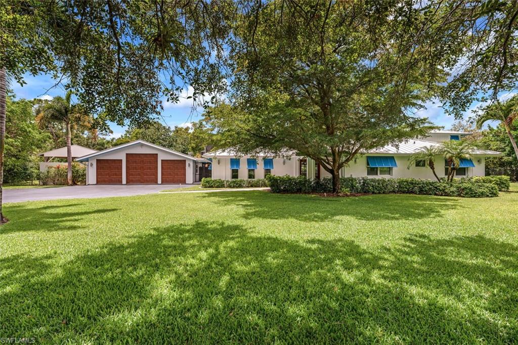 This home survived Hurricane with no damage.  Immaculate, fully updated luxury residence on a private one-and-a-half acre homesite in desirable Pine Ridge.  Discerning owner sparred no expense w/pride of ownership & attention to details when completely renovating this resort style home! Add some BALANCE to your life, relax & escape under your large 'Island Time' Tiki Hut equipped w/outdoor kitchen, sitting area & hammock for the perfect afternoon nap! Lounge in the custom pool & spa while watching a movie on the outdoor projector. Gather your friends for a volleyball game on the sand court. Practice your golf game in the privacy of your backyard w/your very own putting green! The oversized 3 car garage & pole barn is perfect for an RV, boat, workshop, hobby or car enthusiast! We could go on and on with the setting & outside...now for the spectacular inside!  With over 5100 sq feet of living, every room looks like a brand new home!  4 spacious bedrooms featuring 2 master luxury suites, 4.5 completely renovated baths & upper level wraparound deck. The spacious open concept, kitchen & living room w/ fireplace is an entertainer's delight. Centrally located.  Amazement Guaranteed.