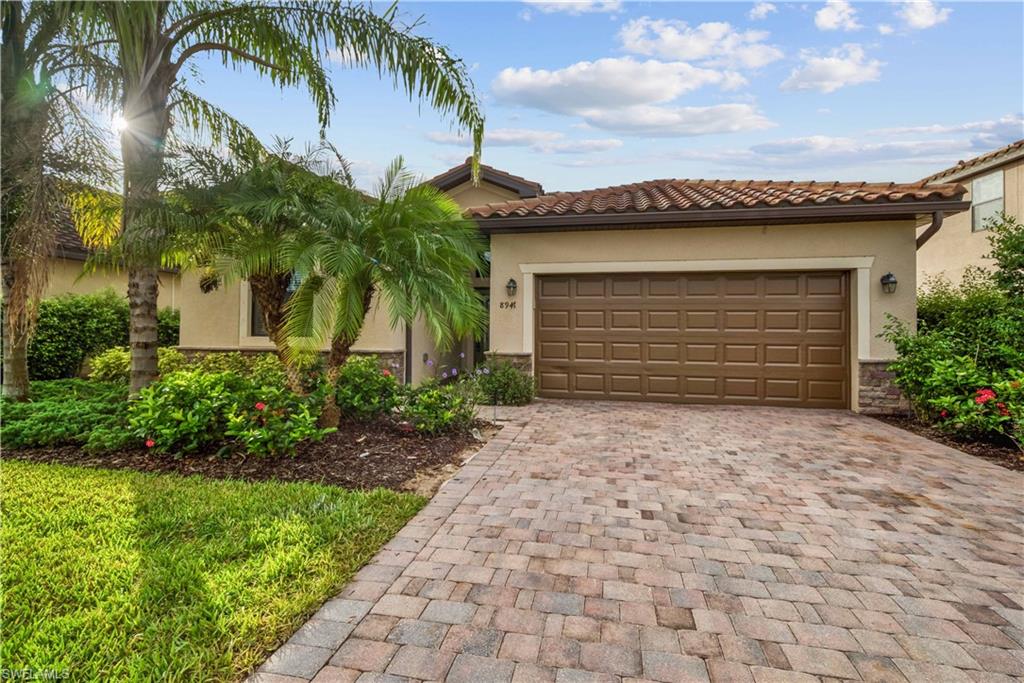 Wow...Wow...Wow...You have to see this stunning 4 bedroom, 3 bathroom w/ 2 car garage home(Trevi Model) in the prestigious Reflection Isles. The home boasts an open floor plan with gourmet kitchen that offers stainless steel appliances, real wood cabinetry, granite countertops, a large island with plenty of space for bar stools and overlooks the huge living room with a walk-in pantry. Your new home also features upgraded 20 inch diagonal tile throughout the living area of the home, fresh paint and crown molding. The master suite has a large bedroom w/ a beautiful bathroom that offers separate sinks, a large garden tub & stunning glass shower. The exterior of the home has lush landscaping and large screened patio that overlooks a lake/landscaped area. The community offers lots of amenities that include: Tennis Courts, Resort Style Pool & Spa, Clubhouse, Fitness Center, Basketball Courts, Tennis & more... The location is terrific, situated just minutes to both The Redsoxs Stadium and twins Stadium, minutes to the SWFL Airport, dining, shopping, hospitals & of course our the world famous beaches of SW Florida. This home is a must see. Call for your private showing today!!!!