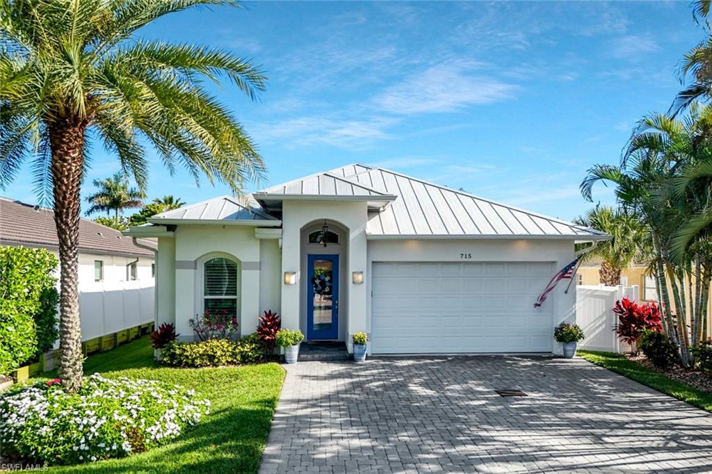 Beautifully appointed home in highly sought-after Naples Park, built in 2019 and offered turnkey for immediate enjoyment. This meticulously maintained residence showcases numerous upgrades throughout, including quartz countertops, a striking granite kitchen backsplash, and all-new appliances.

Thoughtful enhancements continue with updated interior lighting and fans, custom California Closets in the primary suite and pantry, and a built-in lighted beverage center. Designer touches such as shiplap accents add warmth and character, while Hunter Douglas remote-controlled shades provide convenience and style in both the living room and primary bedroom.

Outdoor living is equally impressive, featuring a Delta Heat grill and Challenger grill connected to 1000 gallon propane tank—perfect for entertaining. A whole-home generator with a 1,000-gallon tank offers peace of mind, and new landscape lighting enhances the home’s curb appeal both front and back.

Ideally located just minutes from the world-famous Vanderbilt Beach, as well as premier dining, shopping, and entertainment, this home delivers the best of the Naples lifestyle.