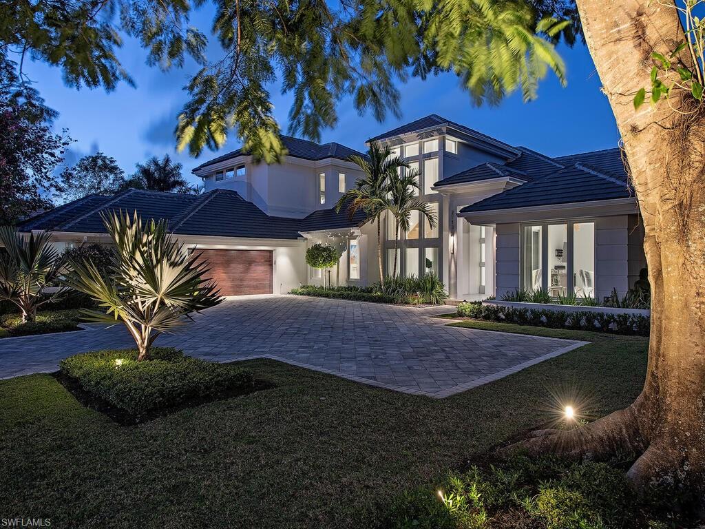 Situated on a sprawling estate lot with phenomenal views over the lake to the Pine Course (5th hole) sits a unique opportunity. Completely re-imagined in 2017 (down to studs and concrete) by the incredible team that GNR Development has assembled, this home offers 5 bedrooms, 4 full and 1 half baths, study, office, 4 bay garage with a lift, and an incredible resort-style pool area that has just completed in 2021. The second level lives as a guest villa; kitchen, living area and 2 guest rooms. Contemporary flair and finishes subtly accent this open plan while maintaining warmth throughout. Wonderful natural light floods the living areas and is complemented by the LED lighting creating an inviting atmosphere. Spectacular landscape and hardscape design by Christian Andrea is clean and crisp offering plenty of guest parking and easy access to the flow thru garage. Completely updated and ready for immediate enjoyment. Exclusions: All artwork; desk & chair in office off master; kitchen table & chairs; coffee table off entry. Golf membership available.
