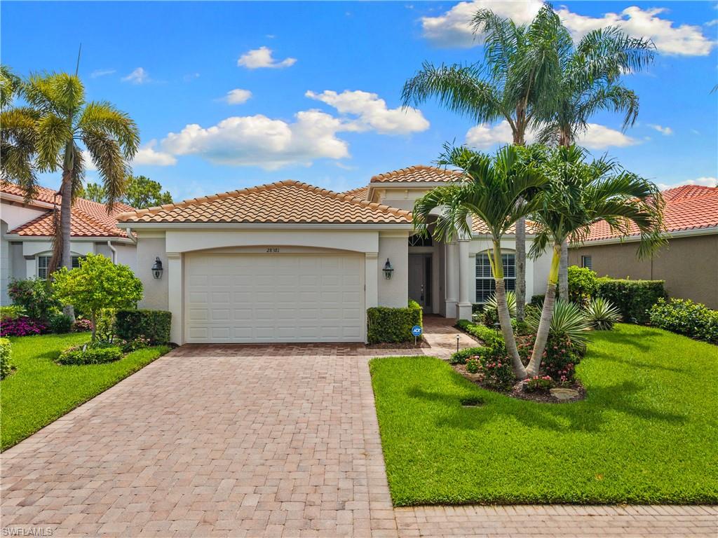 Beautifully renovated and showing like a model, this Vasari Country Club pool home delivers an exceptional combination of modern finishes, golf course views, resort-style outdoor living, and bundled golf value in one of Bonita Springs’ most convenient and sought-after locations. From moment you enter the front door, the home feels fresh, bright, and elevated with soaring ceilings, crisp white walls, contrasting dark plank flooring, plantation shutters, designer lighting, and a clean coastal-modern design throughout. The open-concept kitchen is a true centerpiece, featuring white cabinetry, stainless steel appliances, marble-look counters and backsplash, a large island with breakfast bar seating, and seamless flow into the main living area and lanai. The primary suite opens directly to the pool through French doors and features a beautifully renovated bath with wall-to-wall tile, a glass-enclosed shower, freestanding soaking tub, floating-style vanity, and spa-like finishes. The guest bath has also been tastefully remodeled. Outside, the picture-window screened-in lanai feels like a private resort retreat with a covered seating area, outdoor TV, upgraded natural travertine pool deck, new coping, redesigned waterfall features, and lush tropical landscaping that frames the peaceful golf course views beyond. Additional upgrades include Storm Smart electronic Kevlar hurricane shutters, fresh interior paint, new flooring throughout, custom landscaping, and landscape lighting. Vasari is a highly desirable bundled golf community west of I-75 near the Naples border, offering golf membership with ownership and allowing buyers to avoid the $100,000+ initiation fees and long waiting lists found at many area clubs. Beyond golf, Vasari offers an active and welcoming country club lifestyle with something for everyone, including clubhouse dining, tennis, bocce, fitness, social events, community gatherings, and a growing pickleball program currently under construction. All of this is located just minutes from some of our best beaches, dining, shopping, and entertainment options. Schedule your private tour today and experience one of the best renovated pool home opportunities here in Southwest Florida!