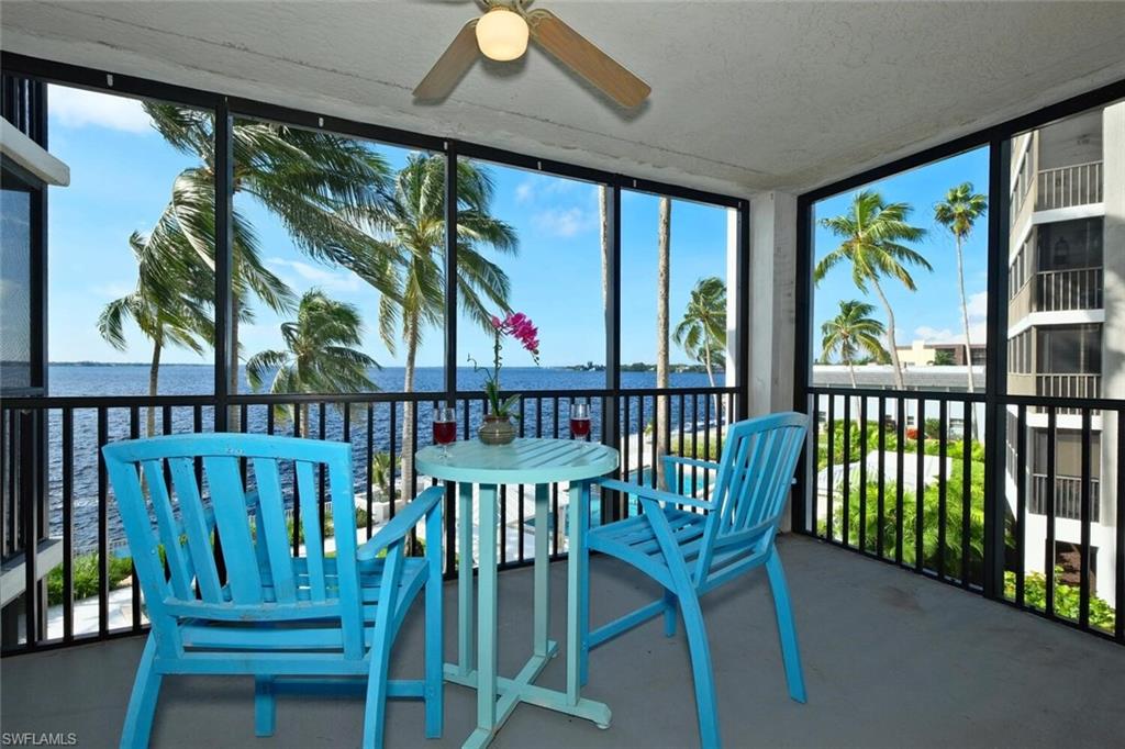 BEST VIEW IN TOWN! Great skyline view of downtown Ft. Myers overlooking the Caloosahatchee River.   This second floor unit has a large living room/dining room with a wall of mirrors to reflect all the natural light.  The kitchen is open to the living room and has granite countertops and newer stainless steel appliances.   The view from the kitchen sink will make clean up fun!  There is a stackable washer and dryer in the condo. There are 3 bedrooms and two baths.  The condo has hurricane impact windows through out and shutters for the sliding doors.   You have a covered carport, extra storage and plenty of guest parking.  Amenities include heated pool and spa, tennis courts, fitness center, sauna,  BBQ area, and a fishing pier and dock,