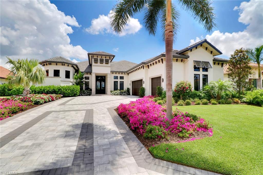 Expansive water views off of the over 3,000 square foot screened in lanai call for a great evening of entertaining with friends and family. Beautiful southern and western exposure create scenic sky views while grilling in the full outdoor kitchen. This home offers the very best with Wolf and Sub-Zero kitchen appliances, surround sound throughout, and its home automation system. Centrally located on the hottest street in all of Talis Park, Seneca Way! Walking distance from all four restaurants, 3 fitness centers, the lap pool, bocce ball, and beach shuttle. Come join this active community. Organic citrus trees grown throughout for you to pick while taking walks on the trails or jog path. Enjoy a day on the Greg Norman / Pete Dye Golf course.