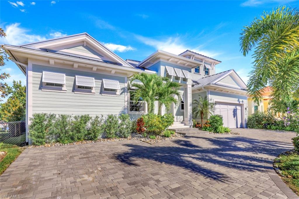 This exquisite, custom-built Divco home is a dream come true. No detail has been overlooked. The direct access home is located in an ideal location with long water views, a deep canal, quick access to the Marco River and a newer seawall. The home has high end finishes all around. The home is completed with a metal roof, landscape lighting, Generac generator, tankless HW heater, hurricane windows, central vac throughout and solid core doors. Each bath has stone that runs all the way to the ceiling and frameless glass doors. In the kitchen, one will find high end appliances, quartz countertops, 72" upgraded cabinets and LED lighting just to name a few upgrades. The first floor primary bedroom has breathtaking views looking straight down the waterway, shiplap upgrades, ceiling features and his and hers custom walk-in closets. The lanai boasts an infinity pool with a sunken hot tub and sun deck in the pool. The dock has a 24,000 lb lift that can accommodate a 35' boar as well as a 4,500 lb Jet Ski lift. Make sure to ask for the full upgrade list.