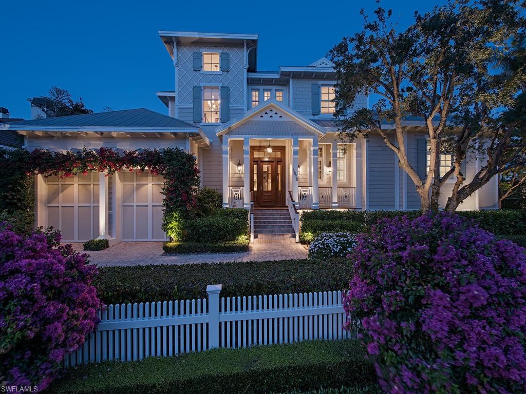 At the Southernmost point of Gulf Shore Blvd South lies a meticulously kept custom built, Stoft-Cooney designed residence, just one house off the beach. With a secluded beach access directly across the boulevard, sunsets are experienced in an intimate and romantic setting.  Thoughtfully designed, with a focus on the Southern sunlit pool and outdoor area, this gracious 5 bedroom home features natural stone counters throughout, Wolf and Sub Zero appliances, four car garage with lift capability, custom millwork, and a separate guest wing with private entrance. Featured in the  Distinctive Homes of America - Volume III, Naples FL hardcover publication, this is a classic example of timeless Old Florida architecture. The metal roof and exterior clapboard with fish scale shingles provide the elements of a beautiful Coastal Cottage aesthetic to be enjoyed for years to come.  A rare offering for the first time on market, perfectly situated just off the beach and a short stroll to the fine shopping and dining of 3rd St South.