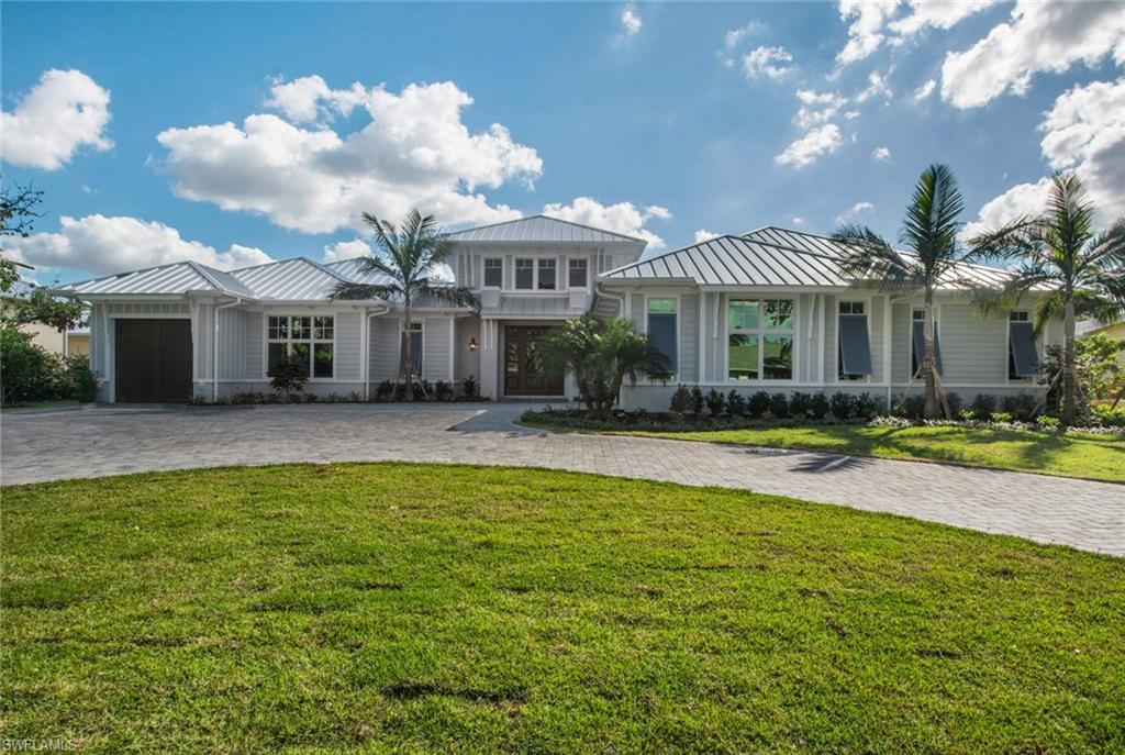 Ideally situated on a .44-acre homesite with southern exposure, this luxury new construction home is fully furnished and ready for immediate occupancy. This one-story home is 3 blocks from the beach, has 4,462 square feet under air with five bedrooms plus study, five baths and three car garages. Two-story windows in the great room fill the home with natural light. Natural finishes and clean designs blend coastal charm with contemporary design in warm and inviting open-air architecture. Enjoy a breathtaking outdoor living area with generous pool/spa, sun shelf, floating stepping stones to the master terrace and a sunken seating area surrounding a fire table. The covered outdoor dining/living areas are protected with motorized screens and feature a fireplace and kitchen. Designed to accommodate virtually every desire the interior features include hard wood floors, a custom gourmet kitchen, home automation, surround sound and a VIP guest suite with a private terrace. Disappearing sliding glass doors bring the outdoors in, allowing you to entertain guests both inside and out, year-round.