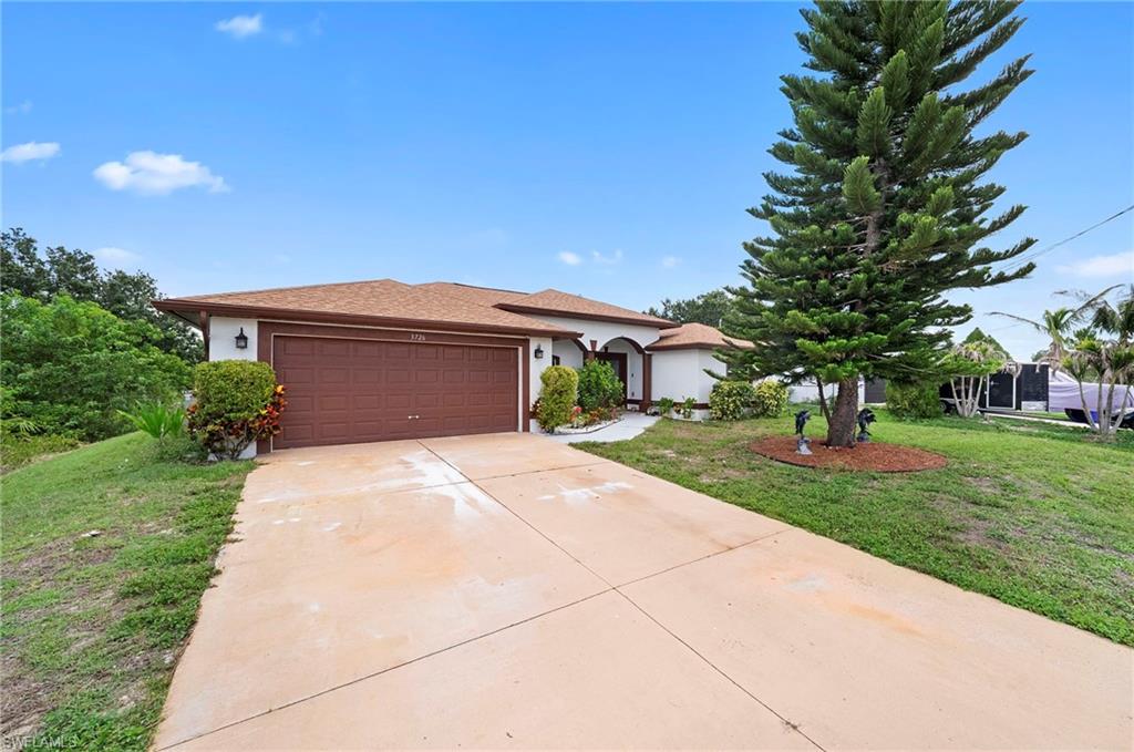 This charming Lehigh Acres retreat offers the perfect blend of style, function, and freedom — with no HOA to limit your lifestyle. Step inside and you'll immediately notice the sleek, fully tiled flooring that flows seamlessly throughout the entire home, offering a clean, cohesive look that's as practical as it is beautiful in the Florida climate.
The heart of this home is a kitchen designed to impress. Featuring hand-painted cabinetry with a one-of-a-kind artisan finish and granite countertops, this space brings warmth and character that you simply won't find in a cookie-cutter build. Whether you're meal-prepping for the week or entertaining guests, this kitchen delivers both personality and performance.
The open floor plan creates an effortless sense of space and flow, making the home feel bright and expansive from the moment you walk in. Natural light moves freely between living areas, giving the home an airy, welcoming atmosphere year-round.
Peace of mind comes built-in here — a 2022 roof replacement means one of a homeowner's biggest concerns is already taken care of for years to come.
Outside, you'll enjoy all the breathing room that Lehigh Acres is known for, with no HOA restrictions to worry about — park your boat, customize your yard, or simply enjoy your space on your own terms.
Conveniently located near shopping, dining, schools, and with easy access to Fort Myers, this home checks every box for first-time buyers, downsizers, and investors alike.
Your next chapter starts here — schedule your private showing today.