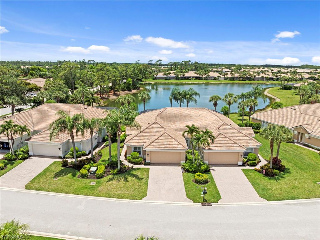 WELCOME to prestigious Colonial Country Club! WOW!! BEST lake view on the peninsula! RARE OPPORTUNITY!   This gorgeous pool home offers an exceptional blend of comfort, elegance, and resort-style living. Featuring 2 bedrooms, with a den that has the flex to be a bedroom, media, or hobby room and 2 full baths, this residence is ideally situated on a premium tropical lot, with plenty of privacy and an expansive lake view! On this premium cul-de-sac lot, you'll find yourself in the heart of it all in Colonial Country Club. Upon entry, you’re welcomed by natural light-filled rooms, warm, custom on the diagonal tile flooring throughout and all designed for effortless Florida living. The chef-inspired kitchen is both functional and luxurious showcasing granite countertops, high-end  newer appliances with a double oven range, deluxe custom pantry with large pull out shelves and a layout that opens seamlessly to the dining area and spacious great room and lanai, making it perfect for entertaining or everyday relaxation. The Primary Suite has been beautifully renovated and serves as a peaceful retreat, featuring a stunning remodeled en-suite bath with a custom tiled walk-in shower, dual vanity basins, tile flooring and a spacious organized walk-in closet. Enjoy tranquil views of the pool and tropical landscape from your peaceful retreat with optimum privacy. The guest room has a key west vibe with plantation shutters and an enchanting window seat. A pocket slider door makes this guest room with full upgraded bath completely private for your guests. Step outside to your tropical lanai overlooking the lush landscape and gorgeous lake view, where you’ll delight in the private sparkling pool, ideal for year-round enjoyment. Whether you’re swimming laps, relaxing poolside, or hosting family and friends, this outdoor space is designed for memorable Florida living. All is enclosed with screen enclosure. Additional highlights are a new roof, new exterior paint, and a mix of accordion and electric hurricane shutters providing comfort, security and peace of mind. Dedicated laundry with tub and cabinets. 2-car garage. Residents enjoy 24/7 guard-gated security and impressive amenities, including the newly renovated 18-hole championship golf course ( this home is on a pay-as-you-play basis), resort-style pools (2 of them being club pools for your use), tennis, pickleball, bocce and a state-of-the-art fitness center with aerobics, water aerobics, and more. The community is known for its vibrant social scene, pickleball, tennis and bocce tournaments, and offering formal dining and the Sunset Grille with indoor and outdoor dining. Colonial Country Club has earned the prestigious Distinguished Club Award and is also recognized as one of America’s Healthiest Clubs. Conveniently located near RSW Airport, I-75, everything you want and just minutes from  world-class beaches and ball stadiums. Come see it, fall in love, and start living where every day feels like a vacation.
