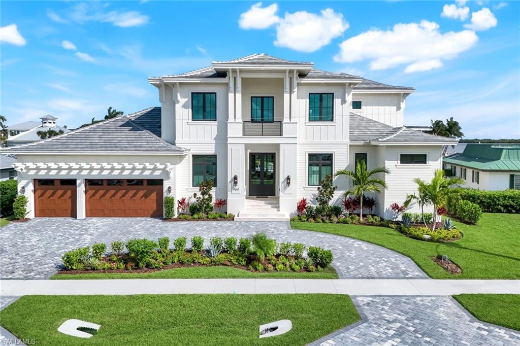 Introducing a grand scale luxury Coastal Contemporary ready for occupancy waterfront estate home custom built by award winning Stonebreaker Builders which has spectacular views of the Marco River and stunning sunsets. This home features a chefs dine in dream kitchen with custom cabinets, designer appliances, Sub Zero and Wolf also butler's pantry which opens up to a great room with expansive views of the Marco River. The master suite is located on the 1st floor and feature's a view of the river as well. Indulge in the luxury master bath with large walk-in shower, soaking tub and his and her vanities. Also located adjacent to the master is the study. There is a junior master also located on the first floor with luxury amenities. Walk thru the sliding doors to your open lanai area which has a chef's outdoor kitchen for your alfresco dining and watch the sunsets. The pool area features an infinity edge pool with a spa. The second story has 3 bedrooms and 3 in suite baths The loft area has a wet bar and opens up to the upstairs lanai which also gives fantastic views of the River. This property is direct access, only 200 ft away from no wake zone and has room for all the water toys as well as a 3-car garage. This is a true custom quality home with numerous custom features and detail