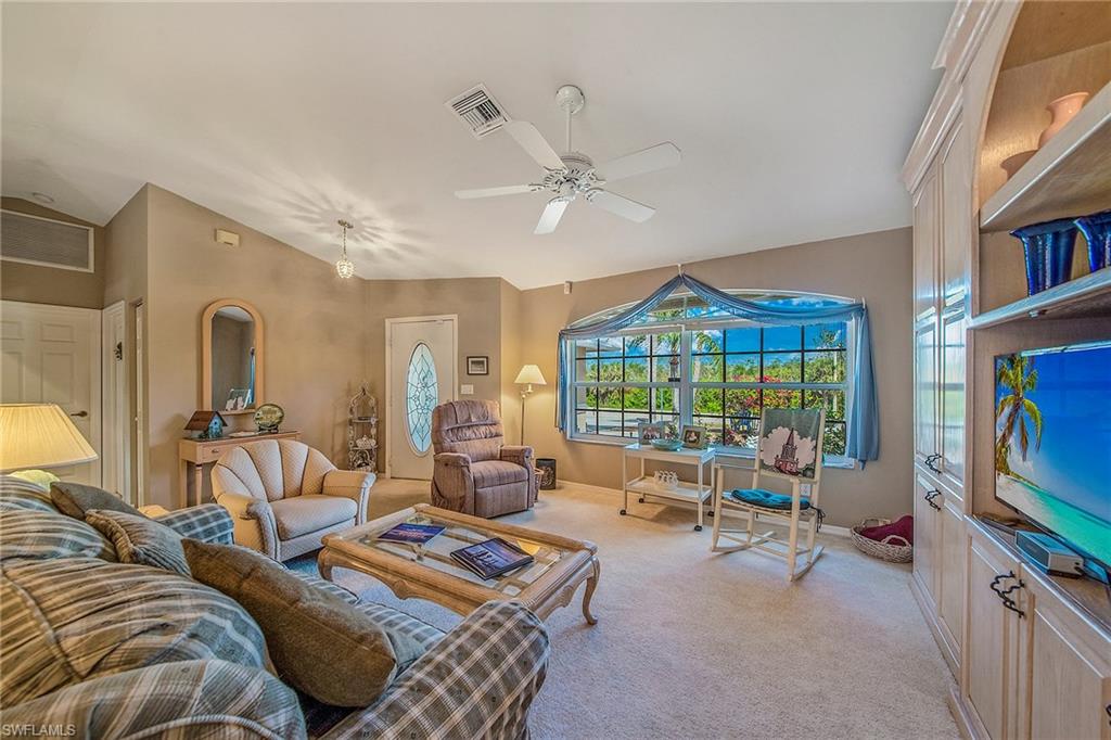 Open airy home with great room floor plan, two master suites with baths and walk-in closets.  Large lanai with covered and open areas with plenty of privacy around the pool. New air conditioner in 2016; new roof in progress.
