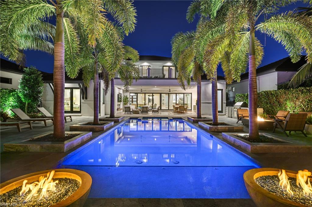 Resort-Style Luxury in The Landings at Bears Paw, Stunning- 4 Bedroom plus Den, 5 1/2 Bath, Custom Home with Gulf Access.
Welcome to The Landings at Bears Paw, Naples, hidden gem tucked between the Gordan River, Greenway Park, and the Jack Nicklaus Signature Bears Paw Golf Course. This stunning 2019-built custom two-story home by MHK Architect & Planning has impeccable finishes and details.  Designed for entertaining and Florida living at its best, the home boasts a Gourmet Kitchen, with Thermador Appliances, Custom Cabinetry, Large Quartzite Island & Full House Generator.
Three bedrooms are all-ensuite, providing privacy and luxury for family and guests. The media room is a showpiece with custom cabinetry, granite counters, and refrigerator drawers-perfect for movie nights, or hosting friends.
Step outside and enjoy your golf course views right from your expansive 1900 sf lanai, featuring a custom fireplace, fully equipped outdoor kitchen, resort-style pool with fire bowls and fire table, perfect for sunset cocktails or weekend gatherings. Plus, your private dock with boat slip offers direct access to the Gulf, for endless adventures.
Every detail has been thoughtfully curated for both function and flair, from spacious living areas to light filled interiors and elegant finishes throughout. This home combines recreation, relaxation, and luxury into one perfect package.
