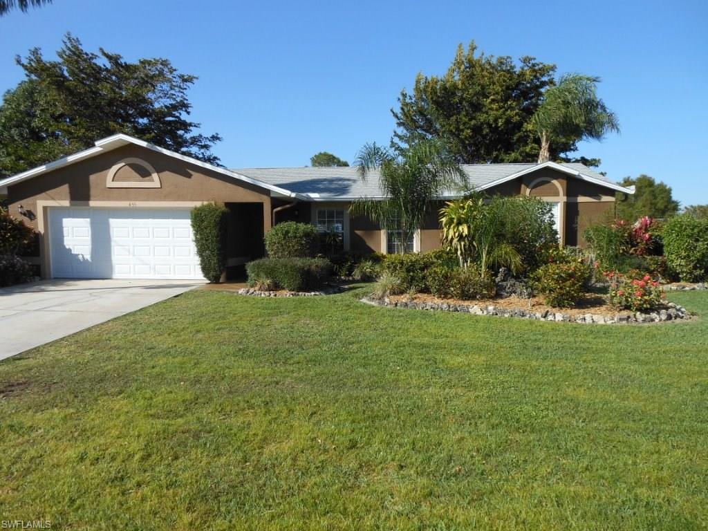 Adorable home in a well established neighborhood. 18x18 ceramic tile throughout. Custom remodeled kitchen with tall cabinets and lots of pull outs, extra designs and molding. Plenty of storage with Kraft Made all wood constructed maple cabinets, solid surface Silestone counter tops, under mount double sink, all stainless steel appliances in kitchen. The master bath and guest baths have granite counter tops and matching wood vanities with mirrored cabinets. Huge custom tiled shower in the master bedroom. Newer roof, wind rated garage door, front door, newer water heater and A/C system with a HEPA air filter. Your private lanai is tiled with privacy screen for your hot tub or patio furnishings. The backyard is completely fenced with mature landscaping and shade trees and plenty of privacy. Walking distance to Copperhead Golf. There are several nearby golf courses to choose from. Easy access to the airport, shopping, dinner theaters, universities, hospitals and the lovely Gulf beaches. Great second or starter home. Quiet, well-kept neighborhood with city water and sewer. Lovely fenced back yard with sprinkler system on a well plus shed.  Call for your private viewing before it's gone!