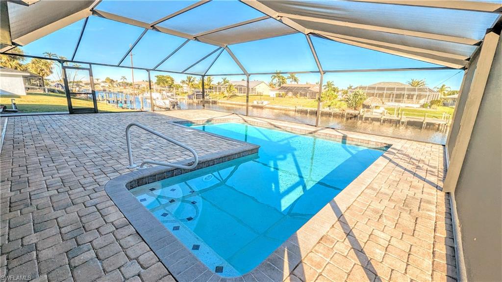 GULF ACCESS/20 MIN TO OPEN WATER!!!! LOWEST BRIDGE TO CLEAR 10'9", SO LARGER BOATS CAN ACCESS LOCATION!  NEW ROOF INSTALLED 06/23!!  NOT IN A FLOOD ZONE!  NO HURRICANE DAMAGE!  HURRICANE IMPACT WINDOWS AND DOORS!  WATER HEATER PLACED 2021.  KITCHEN COMPLETELY REMODELED 2018! NEW POOL AND LANAI ADDED IN 2017! If you are looking for a fantastic GULF ACCESS/POOL home this is the one to get today!!  This home has a huge outdoor lanai for all your family and friends to host amazing pool parties by the canal! Nice concrete addition was added to the large Concrete dock by the canal to fish, Kayak, park your boat/jet ski, and watch the sunrise by the water!  If you are looking to invest in a REALLY GOOD VRBO, this would be a great addition to your portfolio!  This property is minutes away from shopping on Del Prado,  10 mins. to Fort Myers, and 10 mins. to downtown Cape!  You and your guest will love staying here living the Florida paradise dream! DON'T MISS OUT ON THIS INCREDIBLE OPPORTUNITY!!  UPDATE 12-21-23 FRESHLY PAINTED BEDROOMS, ENTRYWAY AND HALLWAY