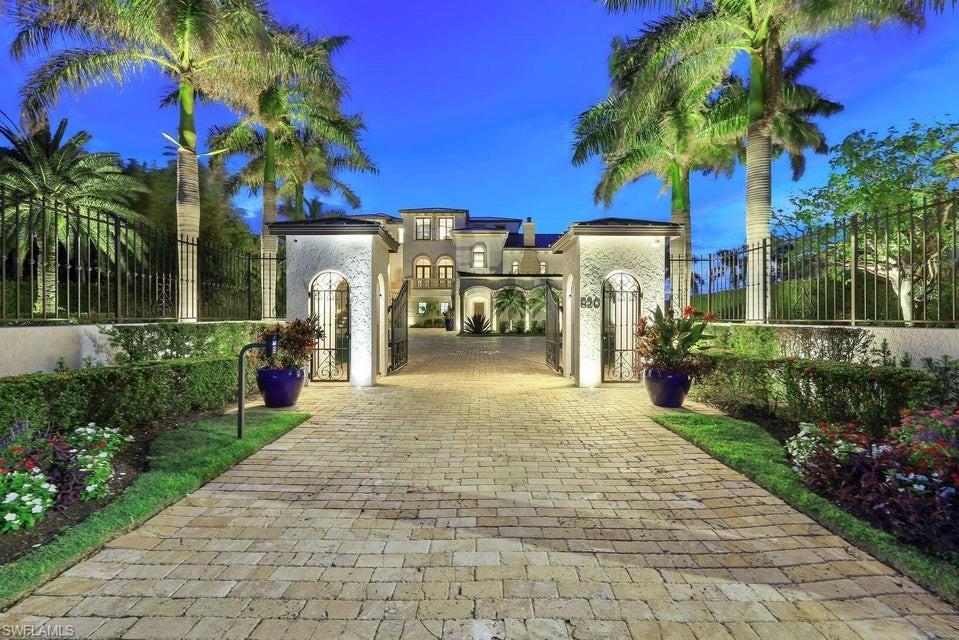 Marco Island's most iconic estate residence situated on a gated private 0.87 acres with expansive views of Roberts Bay. 9188 ft A/C, 15,072 total 5 beds, 5 full baths and 2 half baths plus office, massage room, theatre room and 2 elevators. Air-conditioned garage on the ground level is over 4000sf and features space up to 14 vehicles, one car lift, custom marbled epoxy flooring, walk in vault, kitchenette, half bathroom, storage areas, 500lb ice machine, tackle storage, workshop, air compressor, gym area includes equipment, rubberized floor. Grand foyer featuring custom staircase with intricate ironwork, parlor, expansive master suite with breakfast bar triple French doors leading to a private lanai with bay views. Features include custom trim work, coffered ceilings, travertine, marble and white oak flooring. Gourmet kitchen with Viking 6 burner gas range/microwave, Subzero refrigerator/freezer, 2 Bosche dishwashers, icemaker, pot filler plus Miele espresso machine. Outdoor kitchen Viking grill, fridge & pizza oven. Large lanai, pool/spa. 108' seawall, 69ft dock, 36K LB HI-TIDE lift, jet ski/flats boat platform, driveway access to dock. One of a kind impeccably maintained estate.