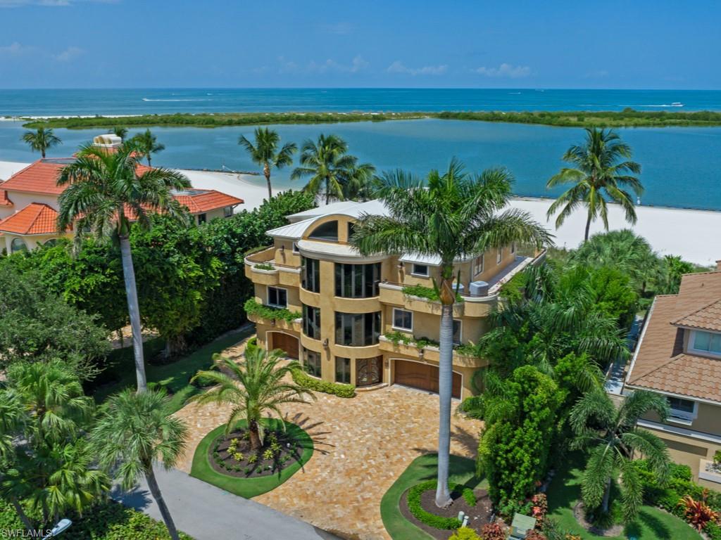Magnificent Beach home in prestigious Hideaway Beach. Panoramic Gulf views with exquisite ambiance showcases the home’s elegance and many desirable features. Upon arrival, embrace an inviting Foyer with soaring detailed ceilings, beautiful interior finishes, classic moldings. solid core interior doors, dramatic open spiral staircase adds drama to each level,optional glass elevator taking you to an easy-flowing floor plan.
Exquisite unmatched craftsmanship throughout, marble/tile floors, extensive millwork, stunning chefs kitchen with double islands, custom cabinetry, high-end appliances by Wolf & Sub-Zero, gas range & multiple refrigeration options including wine, ice maker, refrigerated drawers in island for a entertainer's dream. 

An abundance of windows providing natural light Spacious guest suites spread over 3 levels & lower level Media room. Amazing BEACH and GULF views abound from multiple rooms & decks
A magnificent Great room concept combines dining rm., family rm. making Indoor-outdoor living seamless with  sliders to Lanai entertaining area, salt water infinity-edge pool/Spa, Summer kitchen and electric awnings. Beach access is only steps away. SELLING TURNKEY!