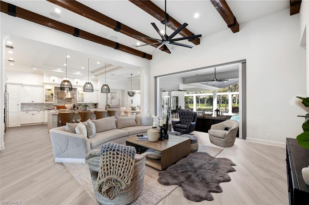 Discover the luxurious charm of Salerno at Miromar Lakes with this newly updated sanctuary, offering an unparalleled living experience. This impressive home spans 4,000 square feet and features 4 spacious bedrooms, 4 elegant bathrooms, a versatile den, and an additional bonus room, providing ample space for relaxation, work, and entertainment.

Every aspect of this residence has been meticulously designed with a focus on refined elegance and modern convenience. The heart of the home is the stunning double-island kitchen, equipped with gleaming stainless steel appliances and designed to inspire culinary creativity. The adjoining grand great room, adorned with rustic wood beams, enhances the inviting and warm ambiance, making it the perfect space for both quiet evenings and social gatherings.

The expansive bonus room, complete with a wet bar, offers a stylish setting for entertaining guests. It seamlessly connects to the large lanai area, creating an ideal flow between indoor and outdoor living. The outdoor space is a highlight, featuring an outdoor kitchen, a custom-designed pool, and a private boat dock along the tranquil lakefront. This serene setting invites you to enjoy leisurely water activities and breathtaking views, enhancing your outdoor lifestyle.

Modern conveniences have been thoughtfully incorporated, including a 240V electric car charging outlet and an air-conditioned 3-car garage, ensuring eco-friendly and comfortable living for your vehicles.

Conveniently located near Southwest International Airport, bustling shopping centers, and the renowned JetBlue Stadium, this residence combines luxury with practical accessibility. Miromar Lakes offers a comprehensive array of resort-style amenities, including pickleball and tennis courts, a marina, a state-of-the-art fitness center, and exquisite dining options. These amenities cater to a variety of interests and provide a lifestyle of exceptional leisure and enjoyment.

This home represents a unique opportunity to experience the epitome of Florida living. Don’t miss your chance to make this exceptional property your own. Welcome to paradise!