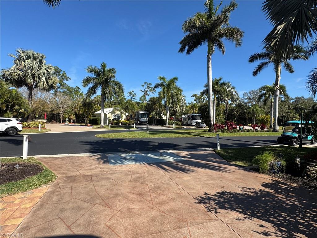 Lot 165 A Private Oasis at RiverBend Motorcoach Resort. Discover the charm of Lot 165, nestled in one of the most peaceful and private locations within RiverBend Motorcoach Resort. This expansive back-in lot welcomes you with lush tropical landscaping and majestic palm trees, creating an atmosphere of serenity and seclusion the moment you arrive. It’s the kind of setting where mornings begin with sunshine filtering through the palms and evenings end with soft breezes and quiet skies. The highlight of this lot is the custom-built outdoor kitchen, a true griller’s paradise and the perfect hub for entertaining. Imagine casual breakfasts outdoors, relaxed afternoon lunches, or sunset cocktails with friends while dinner sizzles on the grill. Plenty of options for seating areas both in the front and back of the lot give you plenty of options to soak up the Florida sunshine during the day or enjoy peaceful evenings under the stars. The coach house is both functional and featuring a kitchenette, a bathroom with shower, and a washer and dryer for added convenience. Whether you're hosting guests or simply enjoying the extra comfort, the space makes entertaining easy. There’s also a generous storage area perfect for bicycles, gardening tools, or anything else that keeps your resort lifestyle running smoothly. One of the most desirable features is the north-facing orientation, helping keep your motorcoach cooler on sunny Florida days. With wide roads and beautifully landscaped surroundings, the setting is ideal for relaxing strolls around the resort or enjoying time outdoors with your four-legged companions. Life at RiverBend Motorcoach Resort offers an exceptional blend of luxury, recreation, and community. Residents enjoy access to a private boat ramp leading to the scenic Caloosahatchee River, making it easy to head out for boating, fishing, or sunset cruises. The resort-style pool, complete with a poolside bar and multiple hot tubs, creates the perfect place to unwind and socialize. For those who enjoy an active lifestyle, RiverBend offers eight pickleball courts, along with bocce, shuffleboard, horseshoes, and a putting green. The community also features a fitness room, billiards room, an R/C racetrack, a charming hobby train garden, and an R/C boating club, just a few of the unique amenities that make RiverBend such a vibrant and engaging place to call home. You're not simply purchasing a property, you're stepping into a welcoming community filled with beautiful surroundings, wonderful neighbors, and a lifestyle designed for relaxation, recreation, and unforgettable moments. Bring your motorcoach and start making memories in this premier resort destination. Your slice of paradise at RiverBend is waiting. Some of the personal property in the images convey with purchase.