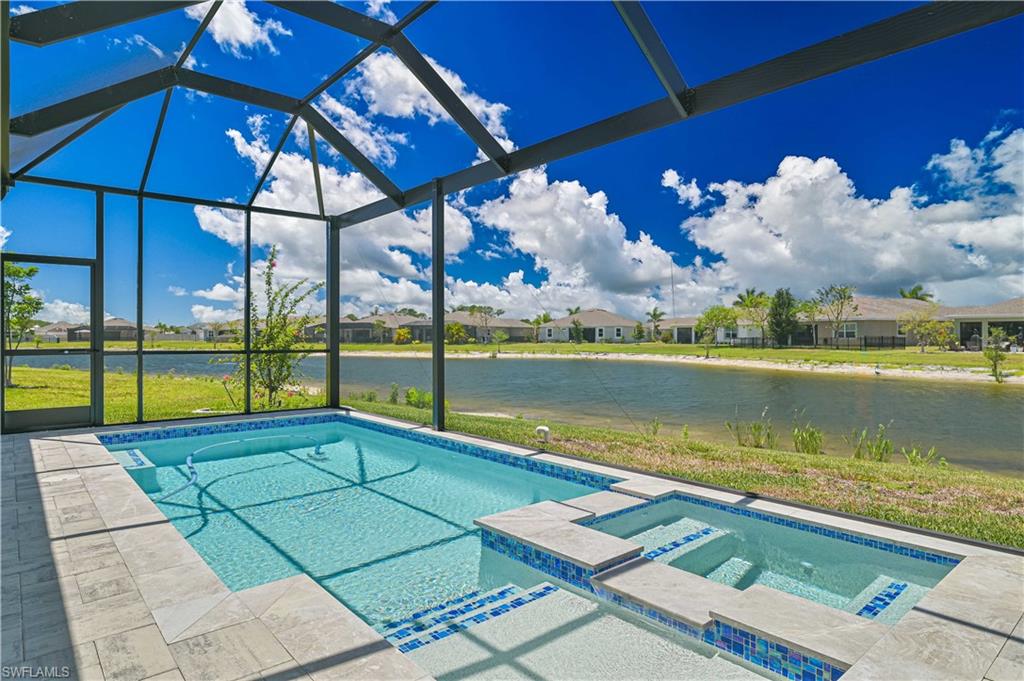 Welcome to this beautifully upgraded lakefront pool home featuring the highly sought-after Shelby floorplan, offering 3 bedrooms, an office/possible 4th bedroom, 2 full baths, 2 half baths, and an extra-deep tandem 3-car garage across 2,257 square feet of thoughtfully designed living space. The exterior showcases exceptional curb appeal with fresh Sherwin-Williams Duration paint, decorative curbing, an expanded paver walkway, and an oversized paver patio overlooking the lake. The newly added custom heated pool features a panoramic picture-window screen enclosure, sun shelf, hot tub, and convenient pool bath, while the lanai is fully equipped for entertaining with a built-in grill, sink, and motorized hurricane screens. Inside, you'll find tile flooring throughout, tray ceilings, upgraded cabinetry and countertops, custom closet systems, and a spacious primary suite with an impact glass sliding door leading directly to the outdoor living area. The kitchen includes upgraded finishes and a hands-free faucet, while the bathrooms feature frameless glass shower doors and additional upgrades. Additional highlights include a Culligan water filtration system, Ring cameras, ADT smart home integration, oversized 8-foot garage doors, a pull-down attic stairway, and a 3-year Consumer Priority Warranty on appliances. Best of all, this property is located outside of a flood zone for added peace of mind.
Located in Brightwater, the area's only 6-acre crystal lagoon community, residents enjoy a beach, cabanas, swim-up bar, inflatables, food trucks, and live entertainment. This move-in-ready home offers the perfect blend of luxury upgrades, functional design, and exceptional outdoor living in a breathtaking lakefront setting. Schedule your showing today!