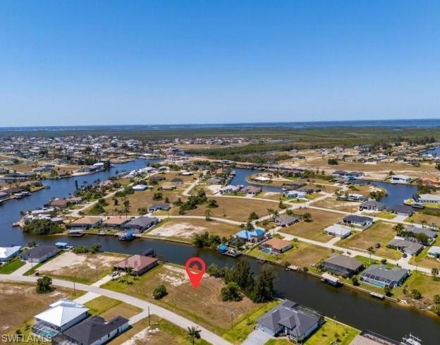 Under contract-accepting backup offers. Prime Saltwater Front Lot in a Growing Area! Build your dream home on this beautiful waterfront lot, surrounded by stunning new construction homes. Enjoy easy access to open water with just one bridge out—perfect for boating enthusiasts. Located only 45 minutes from Fort Myers Beach and close to local restaurants, shops, and everyday conveniences. This is an incredible opportunity at a great price—don’t miss your chance to own a piece of paradise!