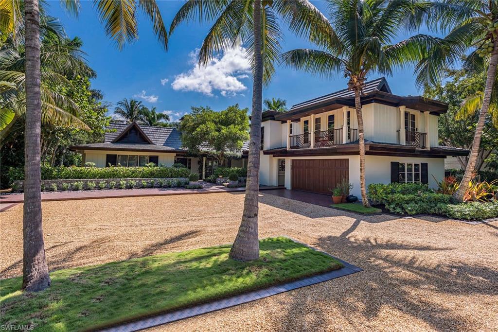 Wonderful Port Royal home. Builders own residence. Beautifully designed landscaping, with lush tropical setting, and clay paver walkways. Available custom home plans designed by Jeff Harrell should you choose to build.  There is a private 2 bedroom guest quarters that was constructed in 2014. This family home has 5 bedrooms, 4.5 baths. There's a 60ft dock with 16,000lbs lift. Enjoy the Port Royal lifestyle today. Port Royal Club membership eligibility.