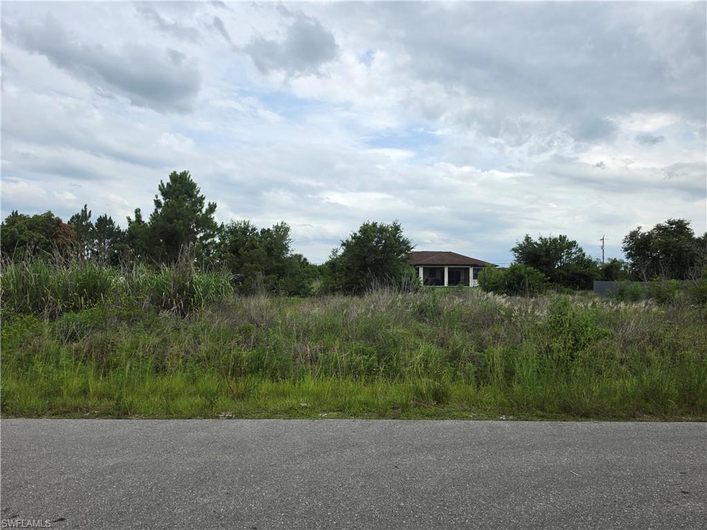 Excellent opportunity to own a 0.25-acre residential homesite located in Lehigh Acres, FL, a rapidly expanding area of Southwest Florida known for new construction and strong long-term growth. This vacant parcel sits on a paved road with electric service available, making it an ideal setting for a future single-family home or investment build. The property offers a clean and straightforward site with a clear environmental inspection, helping streamline the development process. Surrounded by a mix of newly built homes and ongoing residential expansion, the area continues to attract builders and homeowners seeking affordability and space. Convenient access to SR-82, Lee Blvd, Fort Myers, RSW International Airport, schools, shopping centers, and dining options ensures everyday convenience while still maintaining a quiet residential atmosphere. Southwest Florida’s beaches and recreational destinations are also within a comfortable driving distance. Whether you're looking to build now or hold as a future investment, this well-located lot presents strong potential in one of the most active development corridors in Lee County.