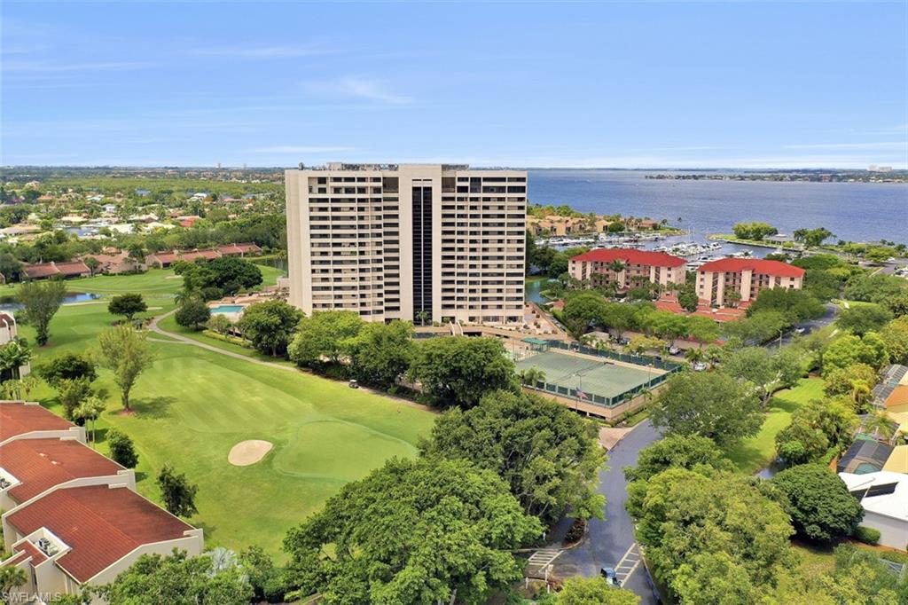 Welcome to Affordable Luxury in the Ariel at The Landings. Calling all Boaters and Golfers -  Known as one of the area’s premier Golf & Country Club communities and Full Service Marina the Landings is one of the few neighborhoods including both. Lives like a home with the benefits of a condo, almost 2,000 SF living area, 2 Large Bedrooms, and 2 Full Bathrooms. Open living room overlooking the lake and golf course. Kitchen features granite counters, a KitchenAid double-oven, and views of the Atrium. Both bedrooms are master suite sized – the formal master bedroom offers private balcony lanai view stunning views, master bathr with tub and shower, and massive walk-in shower. Spacious private balcony overlooking the greens runs the length of the condo unit. AMMENITIES – true gated community w/ guarded entrance, GULF ACCESS wet & dry slip boat storage, boat rentals available too, 16 har tru tennis courts, 8 pickle ball courts, bocce, fitness center, pool directly downstairs, onsite restaurant, private under cover parking & guest parking, and several amenities and cost savings exclusive to the Ariel tower.  Request a copy of amenities and feature list – attached to the MLS.
