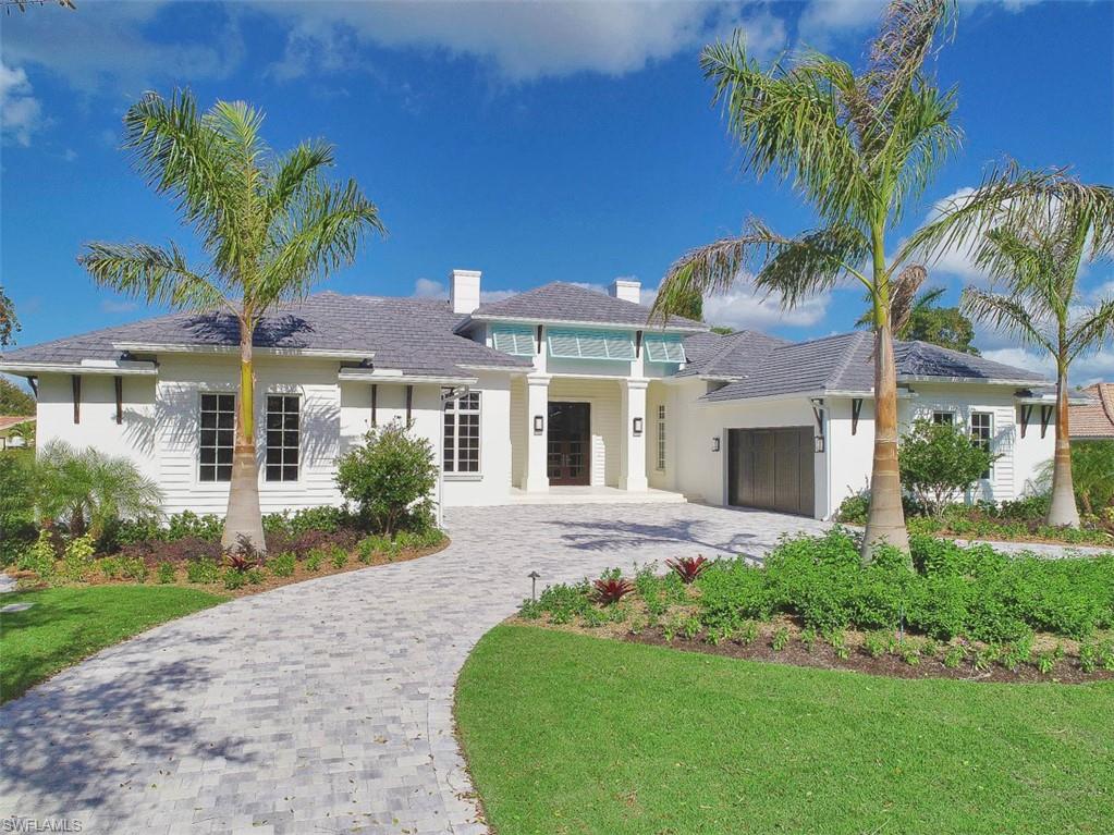 H. 14072 Introducing a stunning new home in the heart of the Moorings on elegant Anchor Rode Drive. Built by Dillman Construction, one of Naples premier luxury builders & designed by RG Designs, this inviting coastal home takes maximum advantage of natural light from every exposure.  Created to reflect today’s indoor/outdoor lifestyle, the home offers the perfect balance of a great room floor plan, PLUS the privacy of a separate living area & den. Incredibly bright and open back garden with 44-foot lap pool & spa, water fountains, bubbling pool and sunshelf. Expansive outdoor living area with kitchen, linear gas fireplace, pool bath, outdoor shower & electric screens & shutters.  Luxury finishes throughout the inside as well, including wide plank Legno Bastone European oak floors, Sorhegui tiles, custom wood trim and wainscoting, and exquisite wall finishes. Other great features include Sub Zero & Wolf appliances, hidden walk in pantry, wet bar and Sub Zero wine cooler. Rounding out the floor plan are 4 bedrooms, each with en-suite bath, and garage space for 4 cars. Perfectly located just minutes to both the private Moorings Beach Park & the shops & restaurants of Venetian Village.