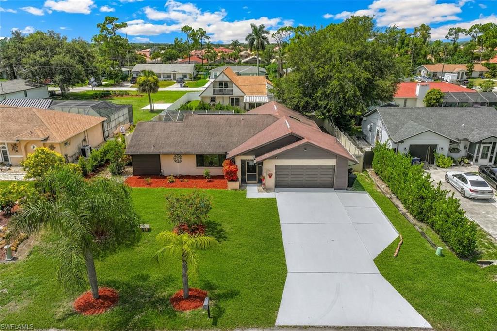 Spacious Pool Home in San Carlos Park! Featuring 3 bedrooms, 2 full baths, 2-car garage, separate living and family rooms adding versatility to your living space!  All the interior has just painted in addition to the garage walls/floor and plus the expanded driveway! Fenced in backyard providing privacy for family & guests enjoying the swimming pool and covered lanai! Updated kitchen with lovely almond-colored cabinetry, granite counter-tops, stainless steel appliances and walk-in pantry! Ceramic tile through main living areas, laminate flooring in bedrooms! All bedrooms feature walk-in closets and ceiling fans! Separate living and family rooms adding plenty of versatility for your living spaces! Outdoor kitchen set up but equipment not warrantied - current owner/tenant never used! Manual Hurricane Shutters, New Hurricane Reinforced Garage Door & Opener! City Water, Septic! No HOA, No Pet Restrictions!