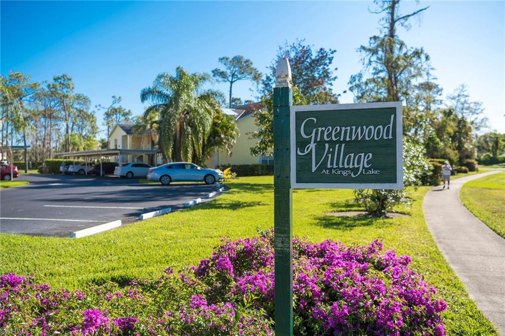 Enjoy easy-living in Naples with this excellent opportunity.  This first floor, end unit located in the intimate non-gated neighborhood of Greenwood Village at Kings Lake features lush landscaping, lots of green park-like areas surrounding the home, and plenty of guest parking.  A clean & well-kept home, offering almost 1,100sf of living space with an open living, dining, and kitchen floor plan. Also features a breakfast bar, screened front entry, screened rear lanai, and a den that can be used as a home office, play room, or 3rd bedroom. Recently fully re-piped (a $4,000 value) and gently used, this home is perfect for seasonal  with the management company taking on all of the maintenance work off of your hands. The tiled rear lanai that spans the full width of the home has Southern exposure overlooking an expansive green lawn & lush colorful landscaping...providing the perfect place to relax or entertain. Greenwood Village features a community pool and a walking path circles the central lake-a hidden gem of the community for all residents to enjoy!