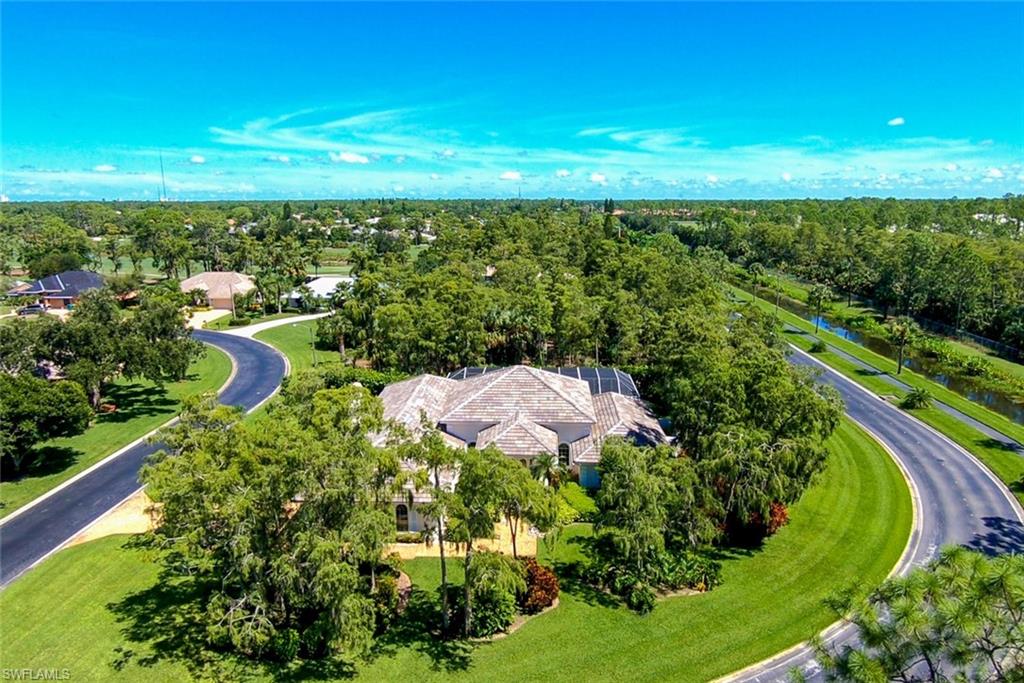H.13477 - This house will wow you. It has a stately presentation on a half acre lot and abuts a nature preserve. The all new travertine salt water pool deck, resurfaced pool and spill over spa are the perfect tropical oasis for family and friends.  This home is remodeled with high end finishes and delightful modern decor. With over 3,300 sq. ft. of living area all rooms are spacious and open.  When you walk through the double front doors there is a wall of sliders to the delightful outdoor living space. All new appliances in the kitchen and fresh modern colors with top of the line quartz make family time wonderful. The kitchen is open to the family room and has a modern tile wall with electric fireplace. All baths are updated and the laundry room has tons of extra cabinets and storage. Most windows have been replaced with impact windows.  The new roof was installed in February of 2018 as was the new pool cage.  Two new ACs are less than 4 yrs old and 2 water heaters are newer too.  Also included is a generator.  You will be so happy you looked at this home.