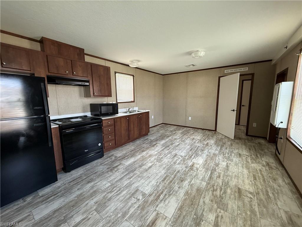 Well-maintained 2-bedroom, 1-bath manufactured home available for lease in close to Ft. Myers & Sanibel/Captiva Beaches. This home features an open-concept living area with luxury vinyl plank flooring throughout and a functional split-bedroom floor plan. The kitchen includes a refrigerator, microwave and range. Neutral finishes throughout provide a clean, move-in-ready interior.
The bathroom features a walk-in tub/shower with accessibility grab bars, and both bedrooms include a built-in dresser for additional storage. Exterior features include a private entrance, new front steps and landing, off-street parking, and access to the community swimming pool if you join the HOA.

Conveniently located near Fort Myers Beach, the Sanibel Causeway, HealthPark Medical Center, shopping, dining, San Carlos Boulevard, and U.S. 41, providing easy access to area amenities and major roadways.
