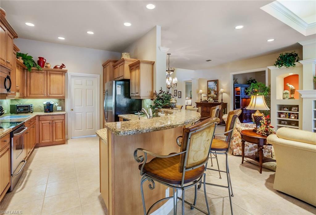 Look no more! This quality built home by Arthur Rutenberg, impeccably maintained, in like-new condition, loaded with upgrades, and being sold furnished, will take your breath away! You'll love the bright open great room floor plan with no wasted space.  2+den and smartly designed a 3rd full bath for overflow guests staying in the den. Beautiful dining area with wall mirrors and wainscoting.  Stunning master bedroom suite with expanded sitting area, colorful wall niches, 2 walk-in closets and luxurious bathroom.  Fabulous kitchen features staggered wood cabinets with crown molding, stainless steel appliances, tiled backsplash, and granite counters with a raised curved breakfast bar.  Enjoy a coffee and paper in the morning room with mitered glass windows overlooking the pool and lake.  Enjoy the sunny, southern exposure of the spacious lanai and heated pool (newer efficient heat pump) overlooking the tranquil lake with many birds and fish. Full storm protection for windows/doors. Pavered driveway. Ownership includes use of the fabulous amenities at the Renaissance Club!